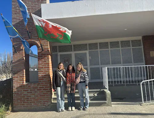 Students holding Welsh and Argentinian flags in Patagonia