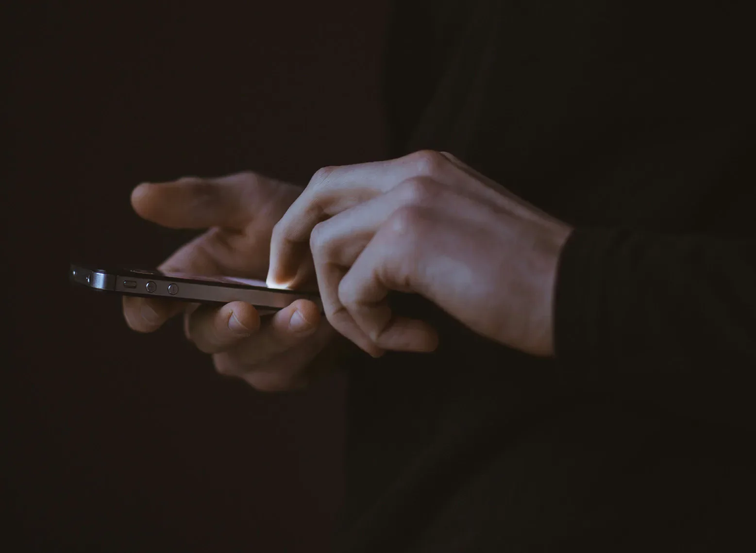 Hands using a smartphone