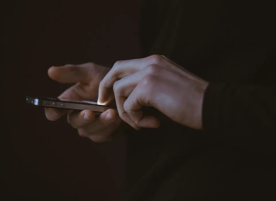 Hands using a smartphone