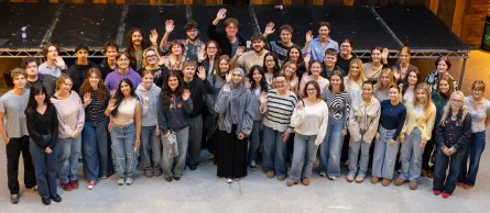 The Gair Rhydd editorial team gathered on a stage