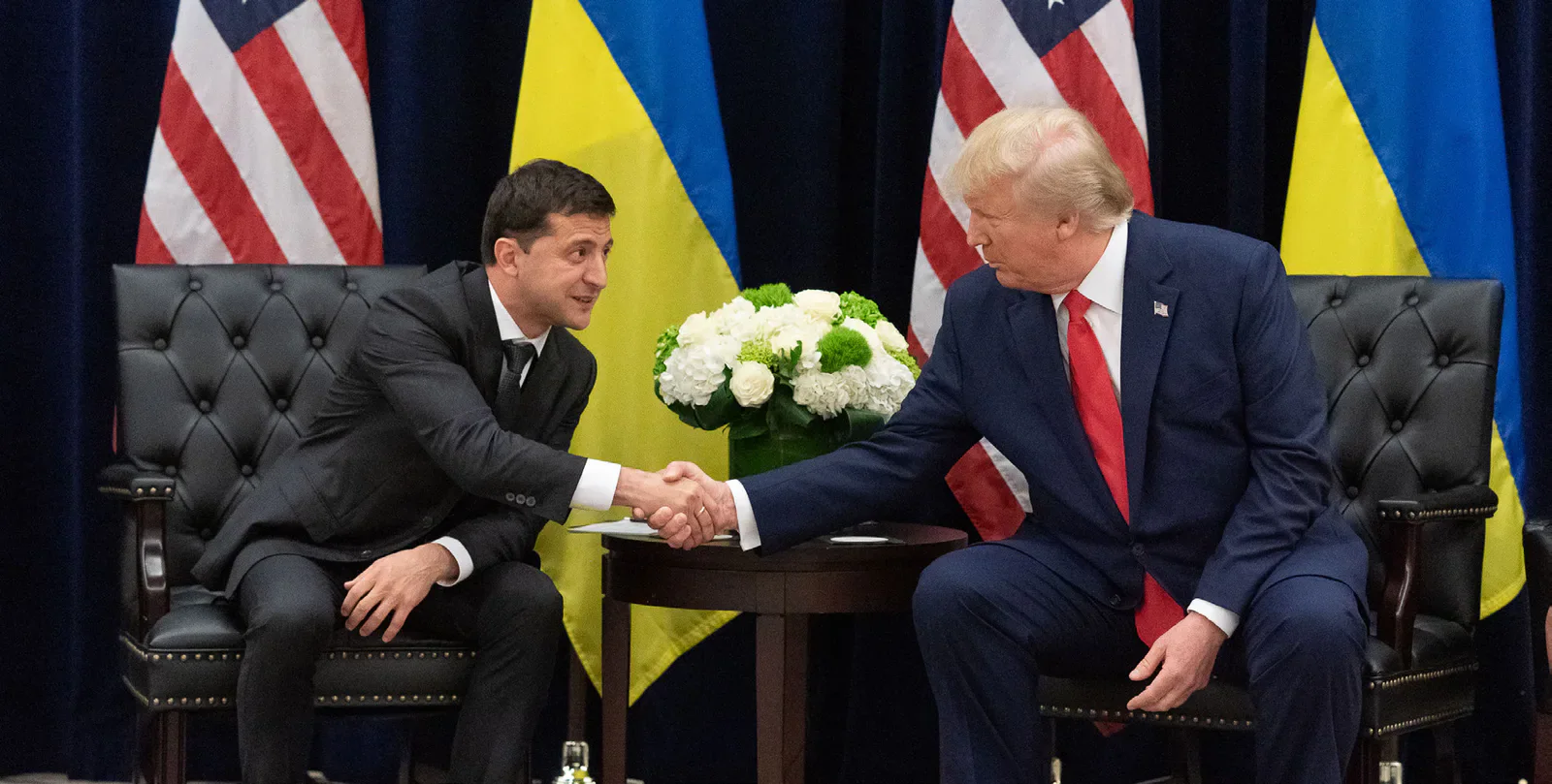 Volodymyr Zelenskyy and Donald Trump shaking hands