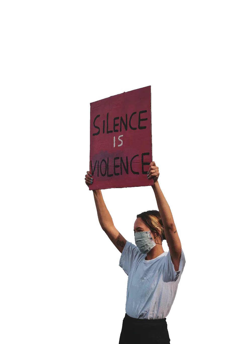 A masked protester holding a sign reading Silence is Violence