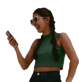 A woman wearing sunglasses looking at a mobile phone.