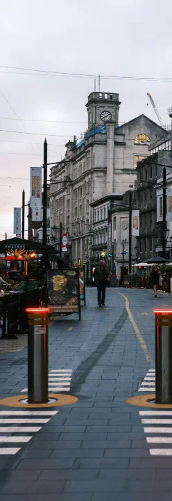 Cardiff Central Square and its clock tower viewed along the pedestrian street.