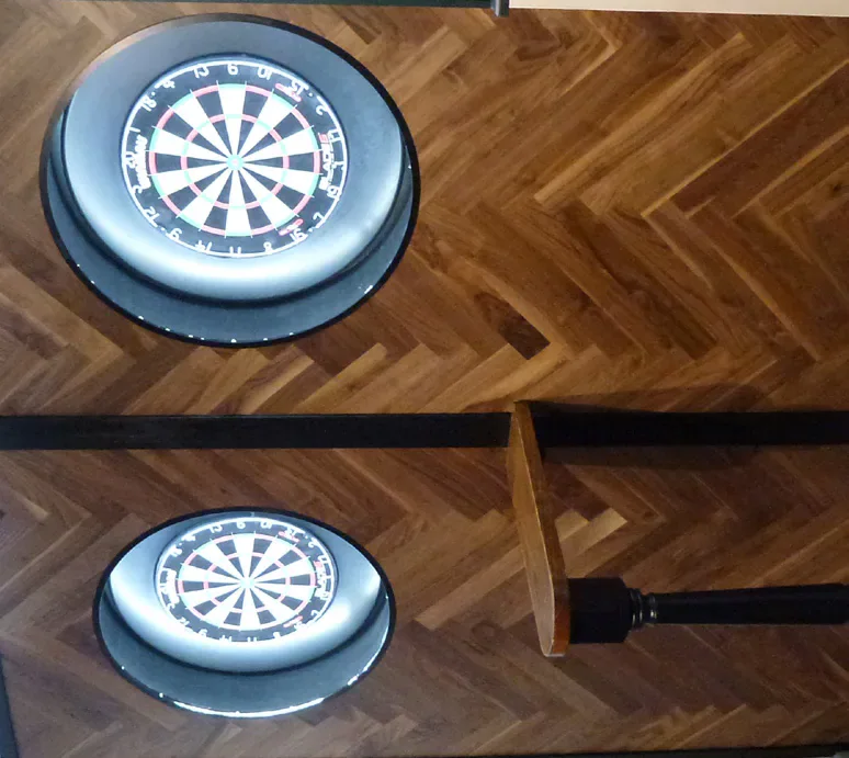Two illuminated dartboards