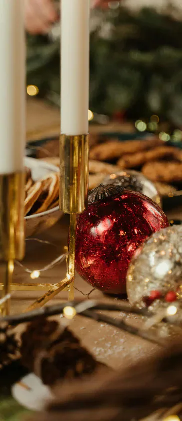 Christmas table decorations with candles and baubles