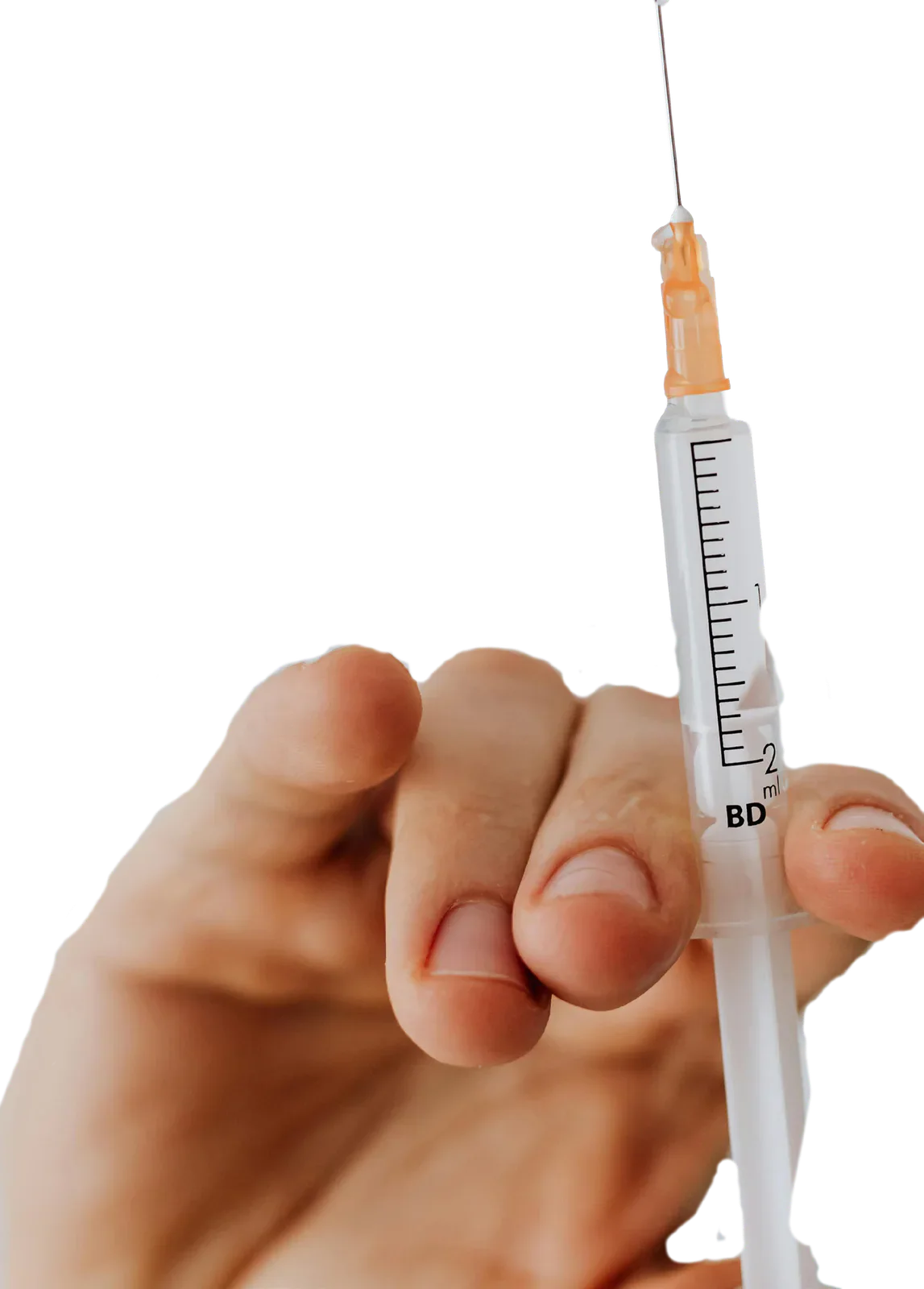 Hand holding a syringe