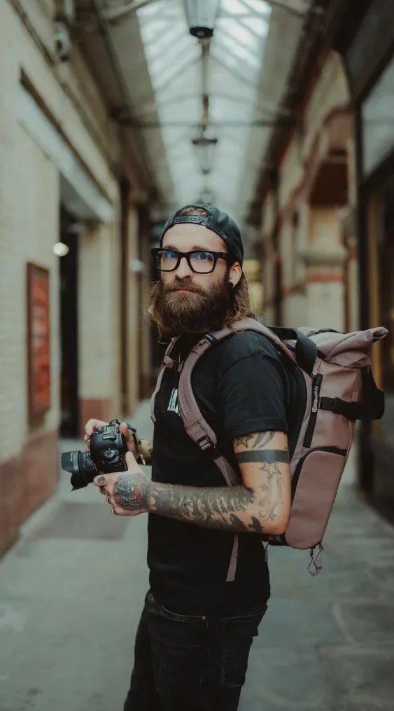 Cardiff street photographer Tom Wilkins holding his camera
