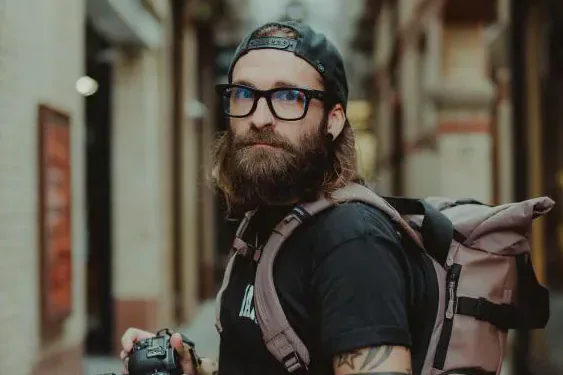 Cardiff street photographer Tom Wilkins holding his camera
