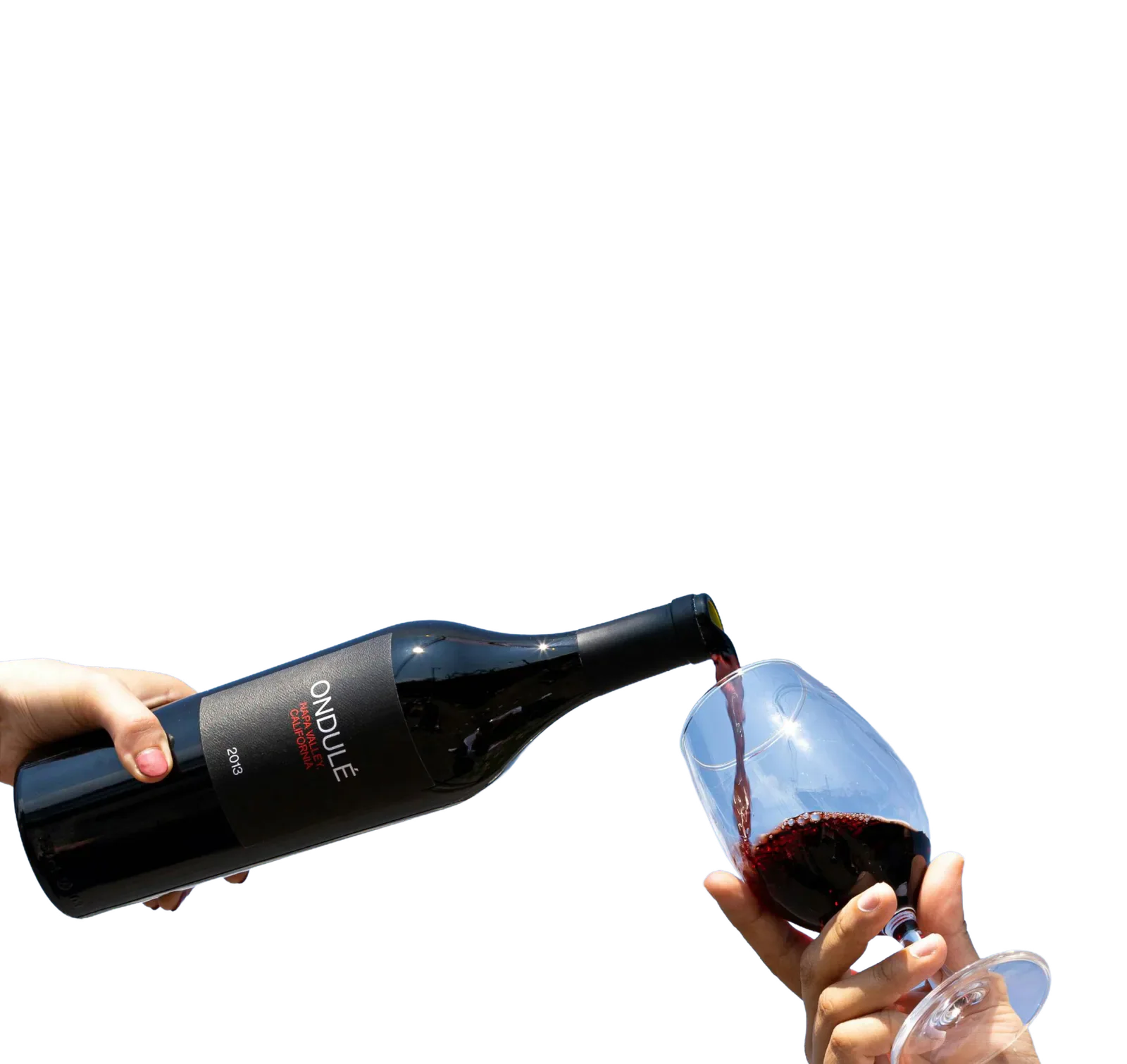 Wine being poured from a bottle into a glass.