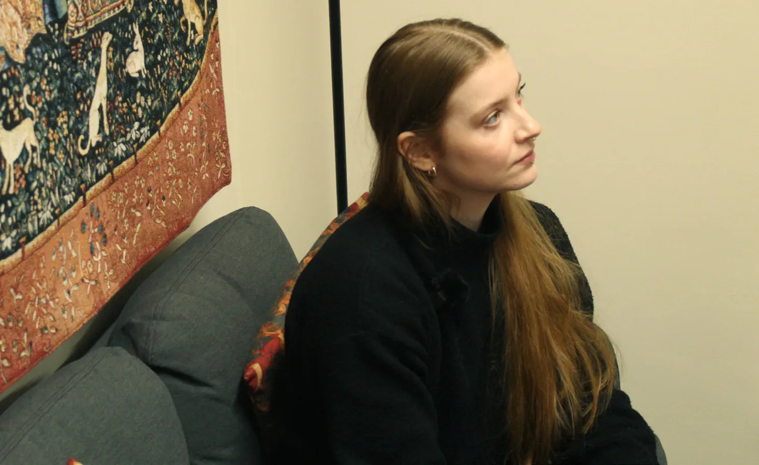 Daisy Dixon listening during the interview.