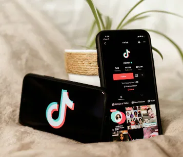 A smartphone and tablet displaying TikTok.