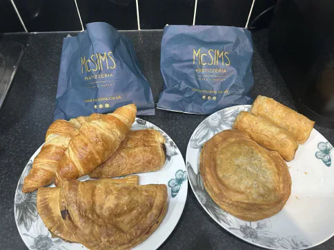 Assorted McSims pastries on plates.