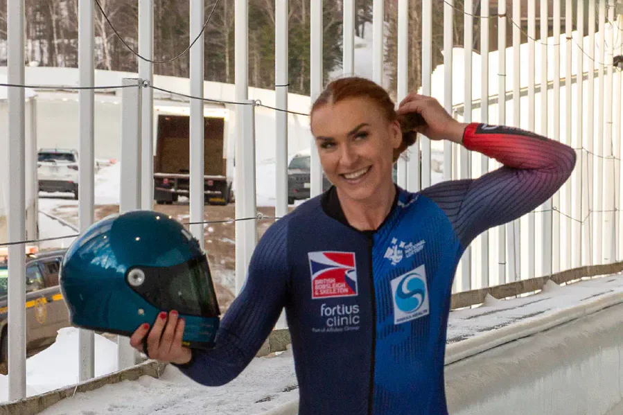 Adele Nicholl holding a bobsleigh helmet