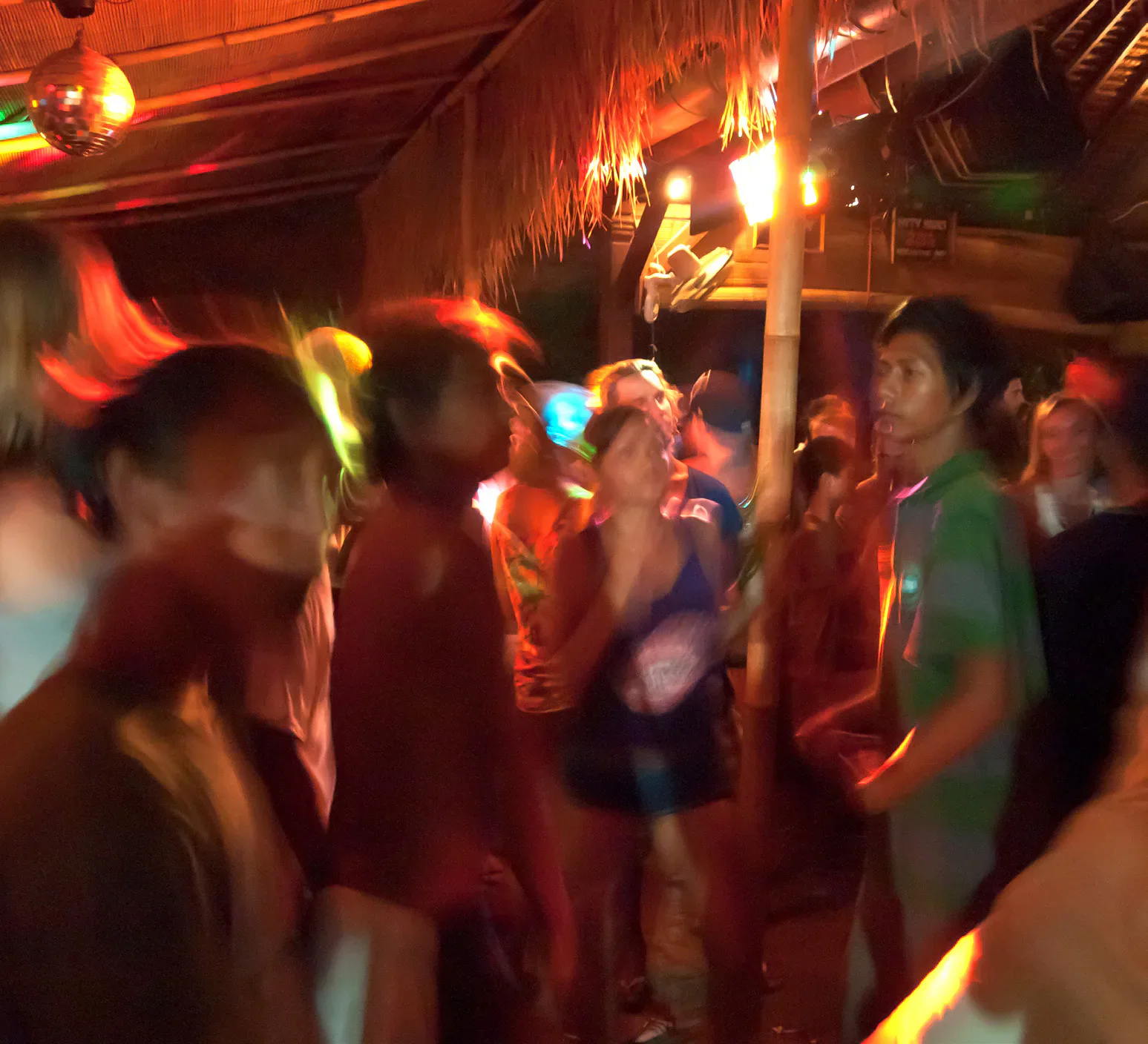 People dancing indoors in Southeast Asia