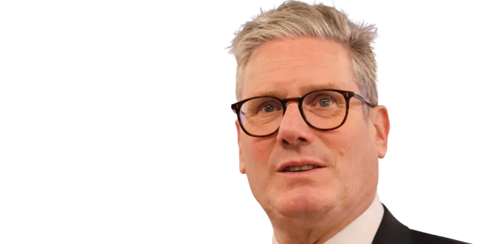 Keir Starmer wearing glasses and a blue tie