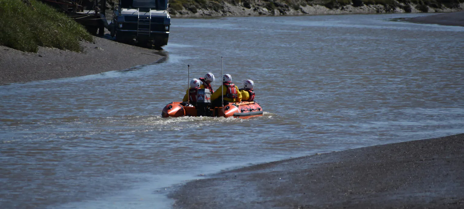 Rescue workers travelling in an inflatable boat