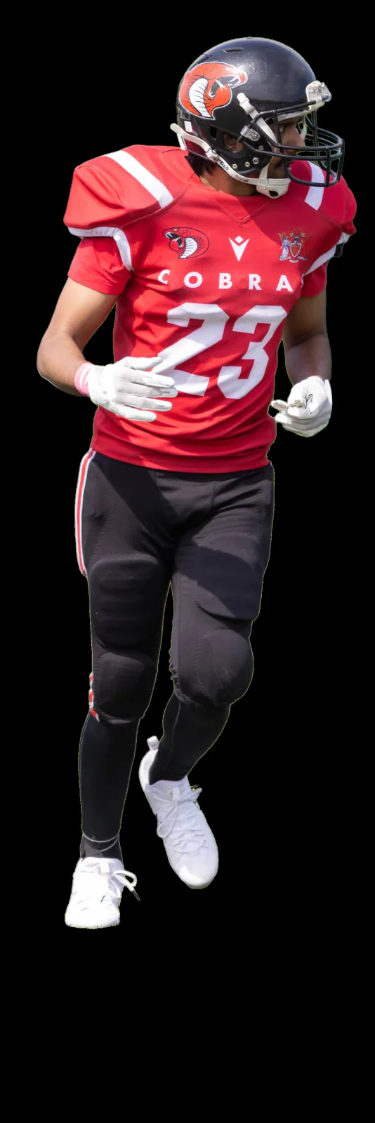 A Cardiff Cobras player wearing number 23 runs in helmet and pads.