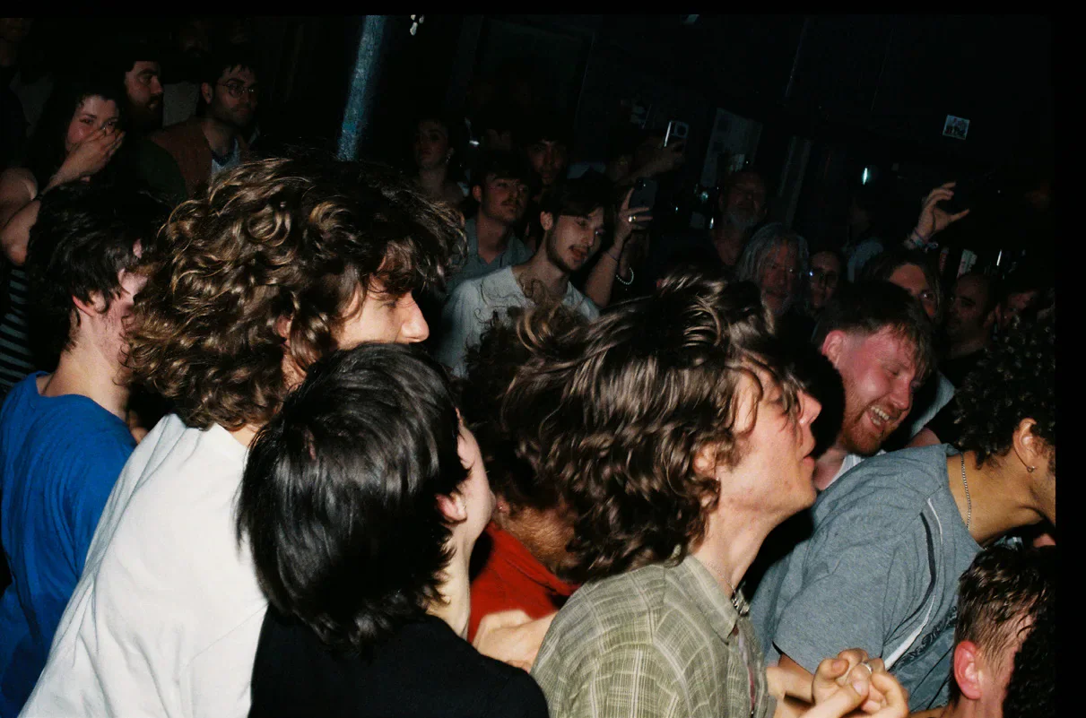 Audience members packed together at a MORN live show.