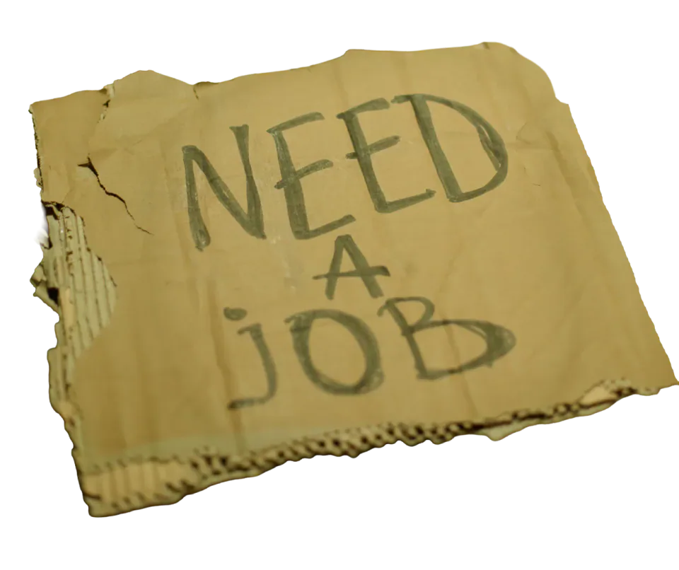 A torn cardboard sign reading ‘Need a job’.