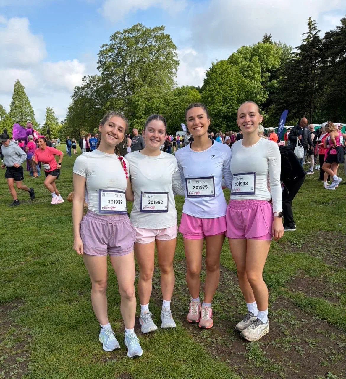 Four Race for Life participants standing together in Bute Park.