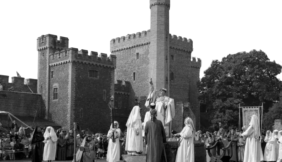 Historical Eisteddfod gathering outside a castle.