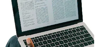 An open laptop displaying a Wikipedia article.