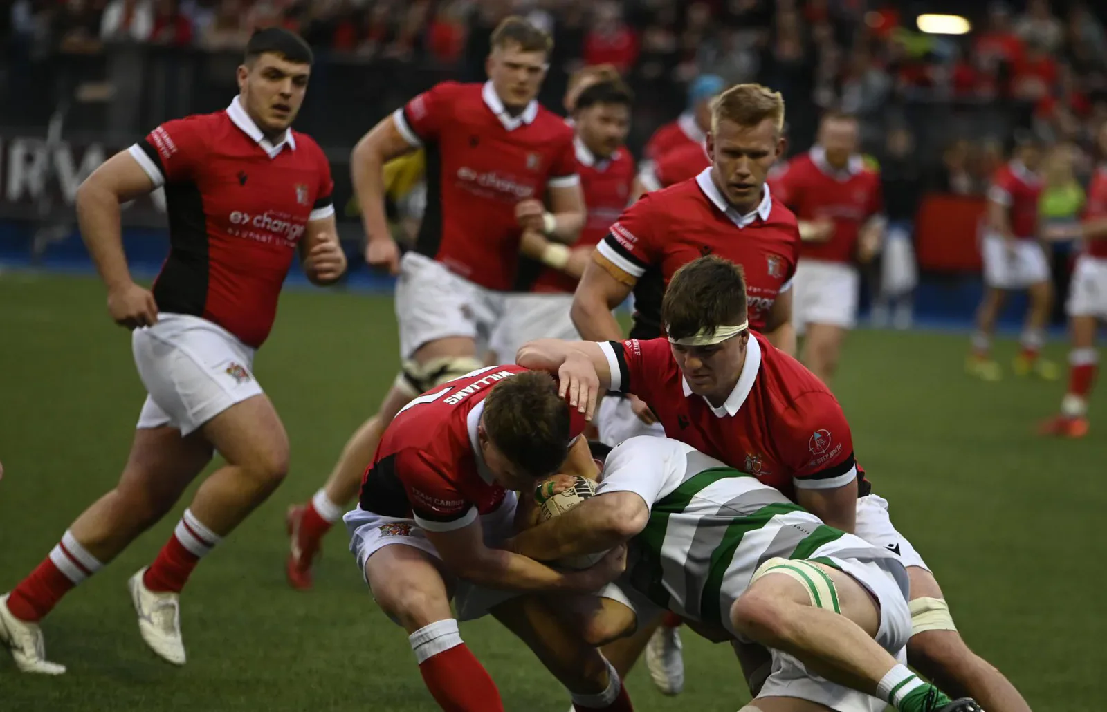 Cardiff players tackle a Swansea ball carrier during the Varsity rugby match.