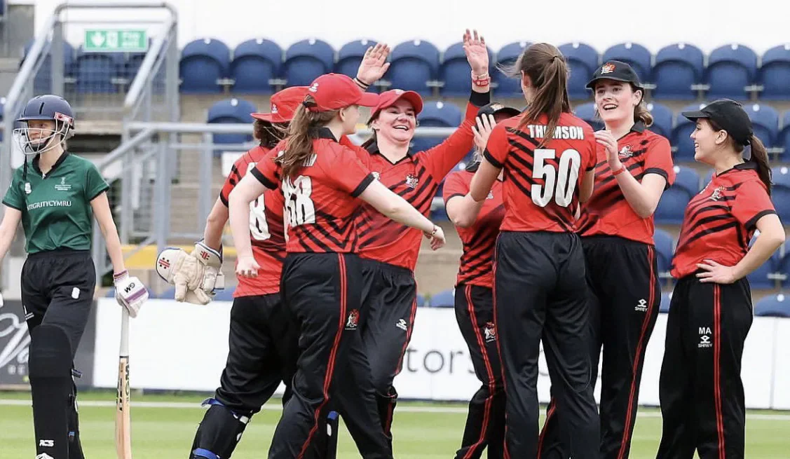 Cardiff women celebrate taking a wicket during the Varsity cricket match.