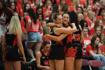 Cardiff netball players embrace after their Varsity victory.